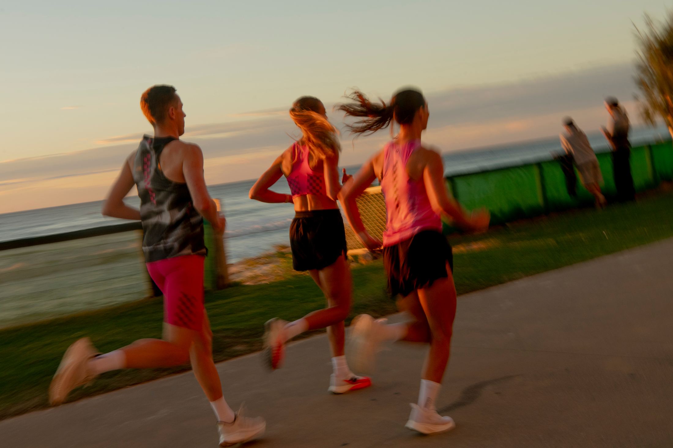Runner in motion beside the Gold Coast at dawn